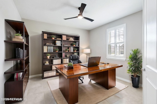 office featuring light tile patterned floors and ceiling fan