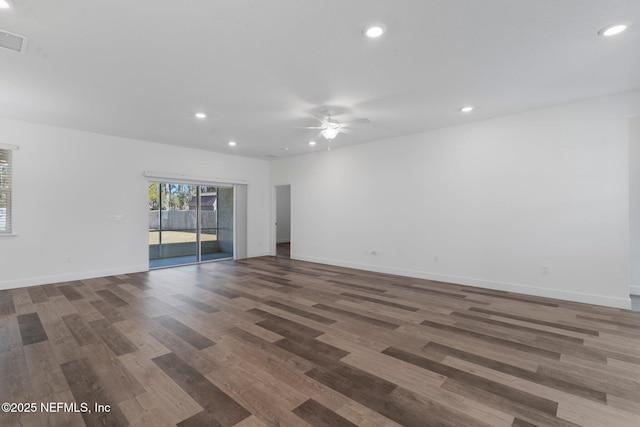 empty room featuring dark hardwood / wood-style floors and ceiling fan