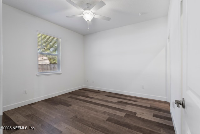 spare room featuring ceiling fan and dark hardwood / wood-style flooring