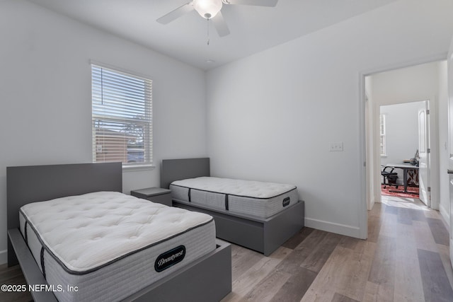 bedroom featuring ceiling fan and light hardwood / wood-style flooring