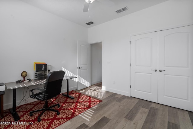 office with hardwood / wood-style flooring and ceiling fan