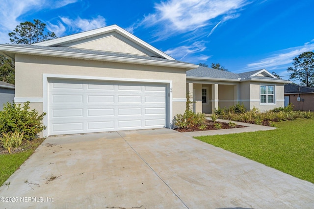 ranch-style house featuring a garage and a front lawn