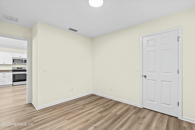 empty room featuring light wood-type flooring