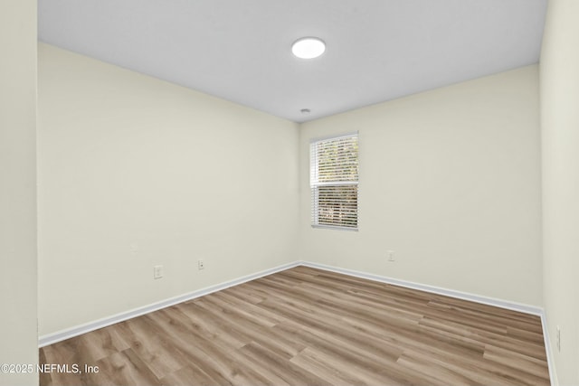 empty room with light hardwood / wood-style floors
