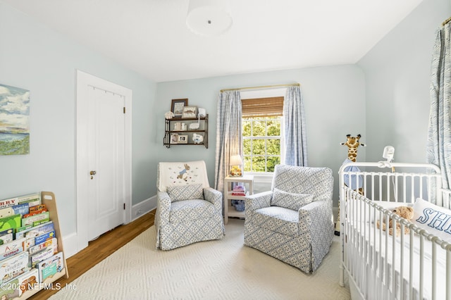 bedroom with wood-type flooring