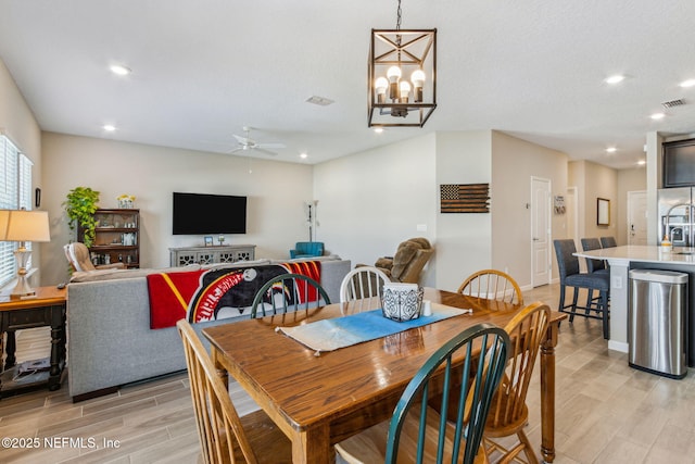 dining space featuring light wood-style floors, recessed lighting, and visible vents