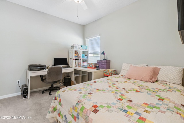 bedroom featuring light carpet, ceiling fan, and baseboards