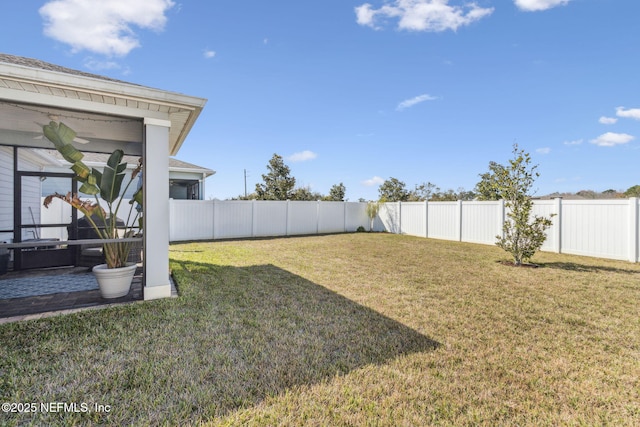 view of yard with a fenced backyard