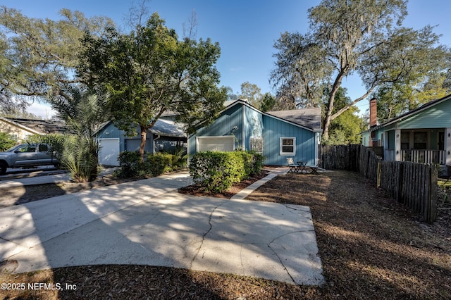 exterior space featuring a garage and an outdoor structure