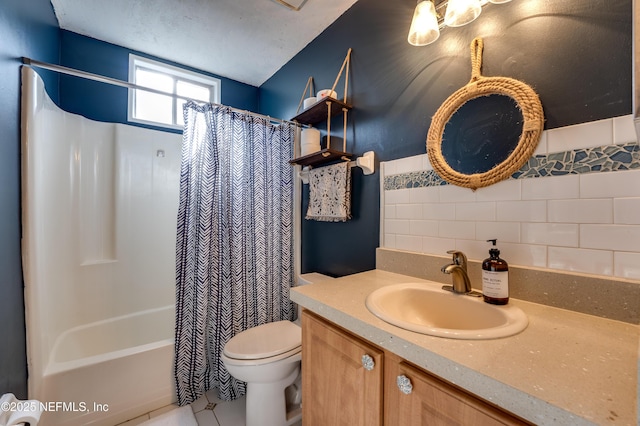 full bathroom featuring vanity, toilet, shower / tub combo, and a textured ceiling