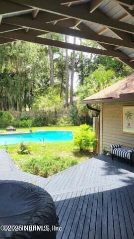 exterior space featuring ceiling fan