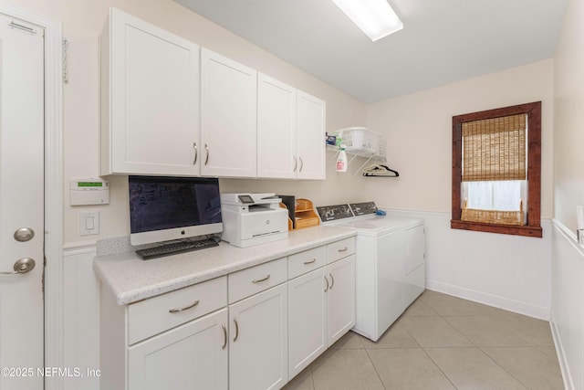 washroom featuring light tile patterned flooring and washer and clothes dryer