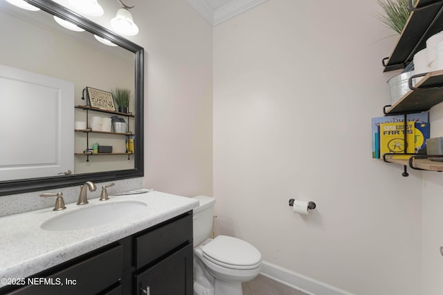 bathroom with vanity, crown molding, tile patterned floors, and toilet