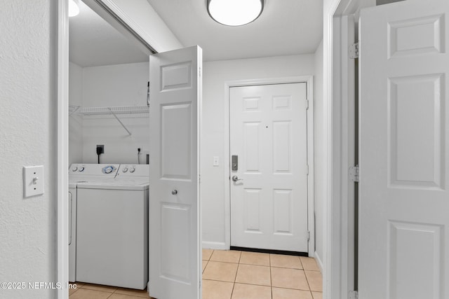 laundry area featuring light tile patterned floors and electric dryer hookup