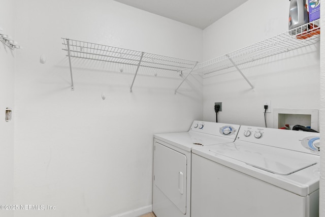 laundry room with independent washer and dryer