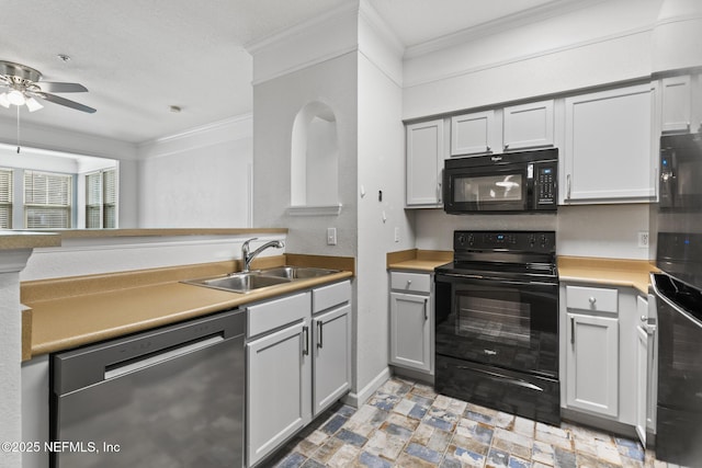 kitchen featuring gray cabinets, sink, ceiling fan, black appliances, and crown molding