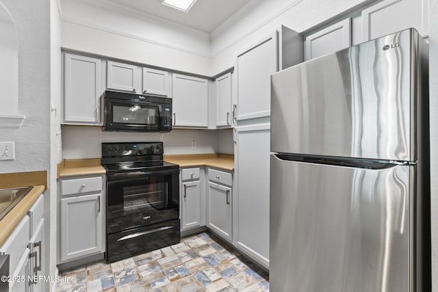 kitchen featuring gray cabinets, ornamental molding, and black appliances