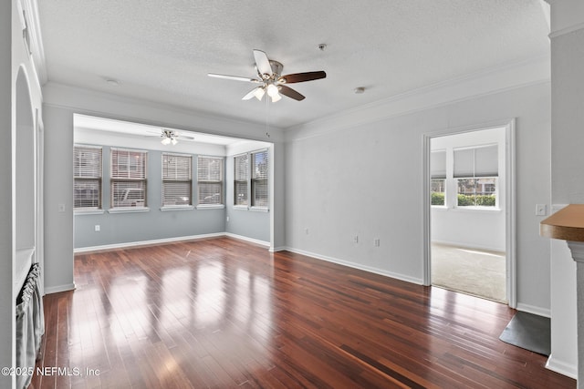 unfurnished living room featuring ceiling fan, ornamental molding, dark hardwood / wood-style floors, and a textured ceiling