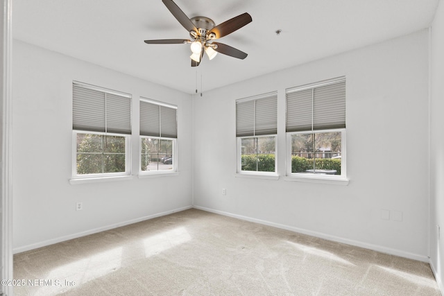 carpeted empty room with ceiling fan