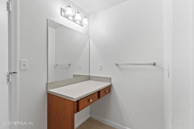 bathroom featuring tile patterned floors and vanity