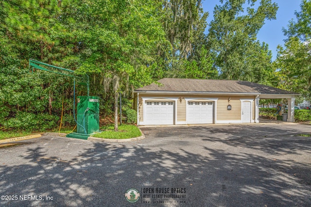 garage featuring a carport