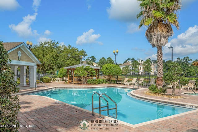 view of pool featuring a gazebo and a patio