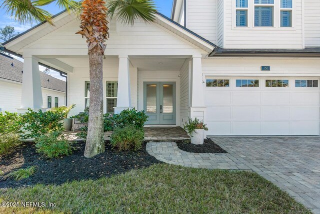 view of exterior entry with a garage