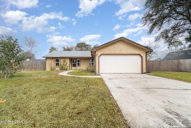 single story home featuring a garage and a front lawn