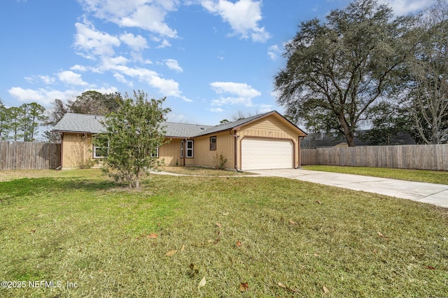 ranch-style house featuring a garage and a front lawn