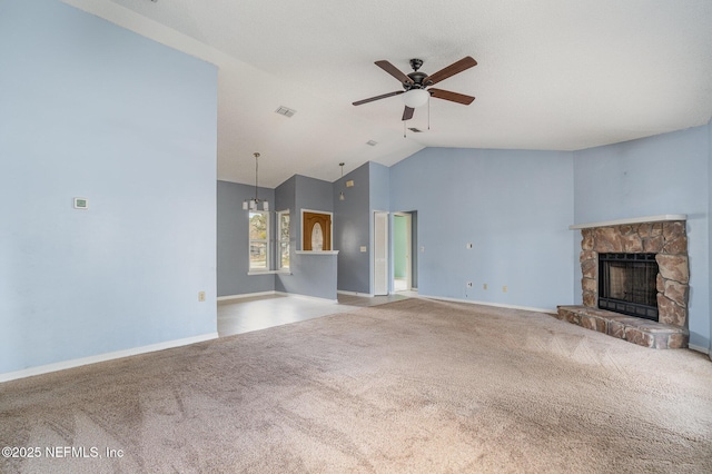 unfurnished living room with lofted ceiling, a fireplace, carpet floors, and ceiling fan