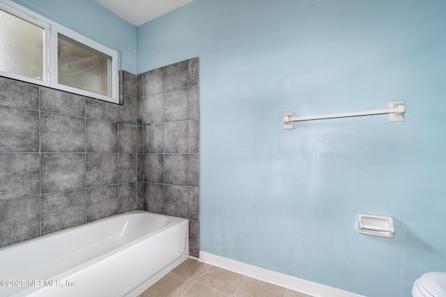 bathroom featuring tile patterned flooring, shower / bathtub combination, and toilet