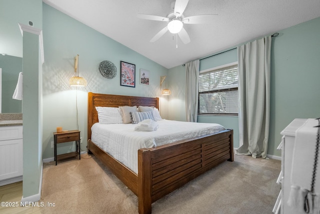 carpeted bedroom featuring vaulted ceiling and ceiling fan