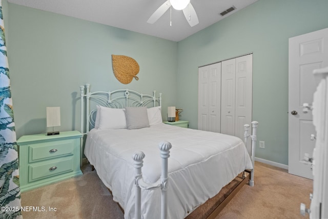 carpeted bedroom with a closet and ceiling fan