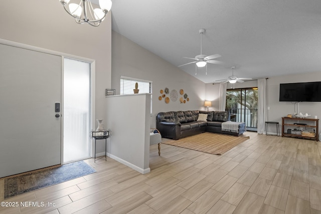 unfurnished living room featuring high vaulted ceiling and a chandelier