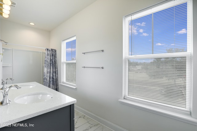 bathroom featuring vanity and curtained shower