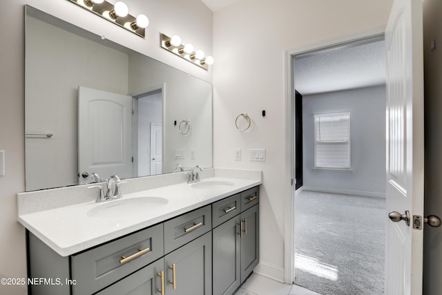 bathroom featuring vanity and a textured ceiling