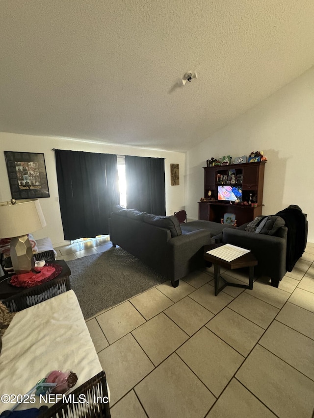 tiled living room featuring vaulted ceiling and a textured ceiling