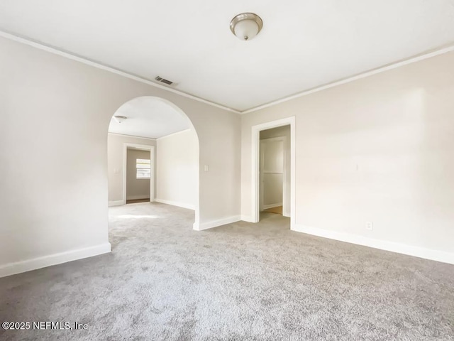 carpeted empty room with crown molding