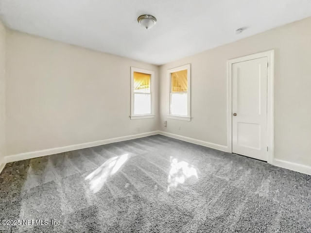 unfurnished room with carpet flooring