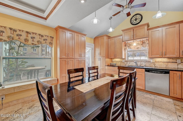 dining area with vaulted ceiling, sink, and ceiling fan