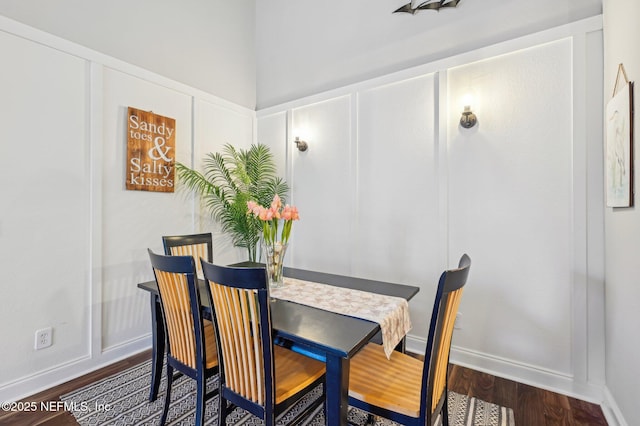 dining area with dark hardwood / wood-style flooring