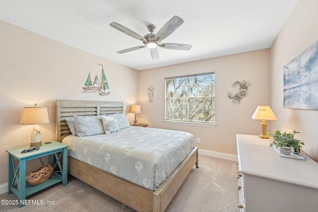 bedroom with light colored carpet and ceiling fan