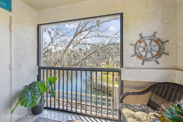 sunroom with a water view