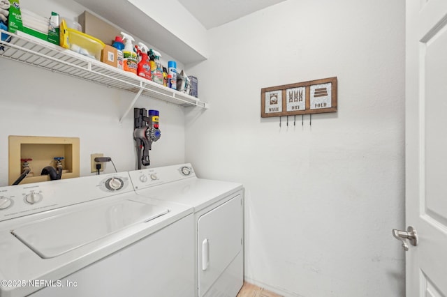 laundry room with washing machine and clothes dryer