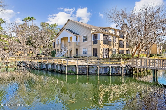 back of property with a water view