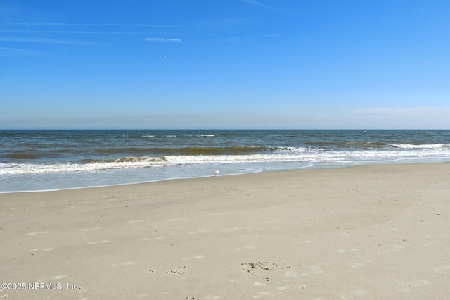 property view of water featuring a beach view