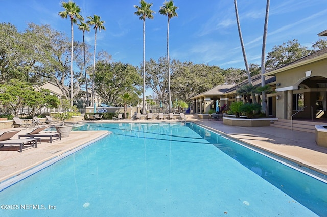 view of swimming pool featuring a patio