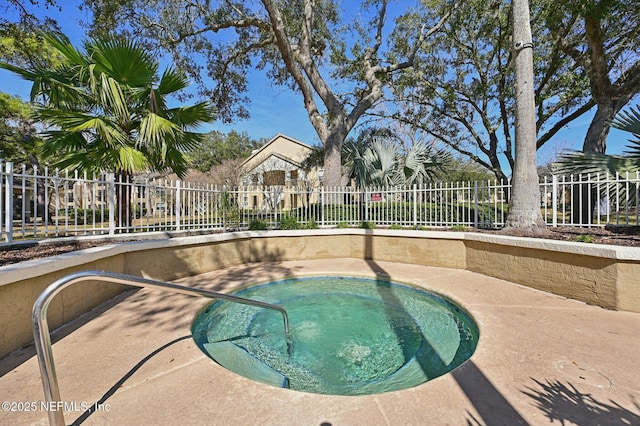 view of swimming pool featuring a community hot tub