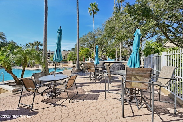 view of patio featuring a community pool