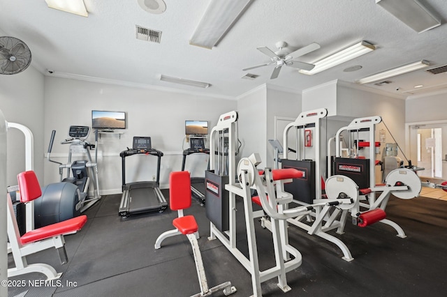 gym featuring ceiling fan, ornamental molding, and a textured ceiling